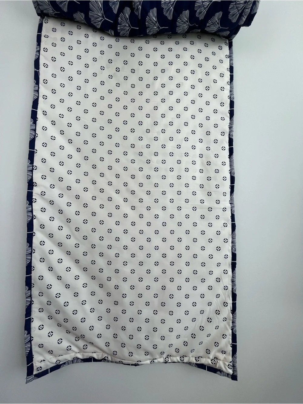 Draper James navy blue quilted ginkgo print king size pillow shams.